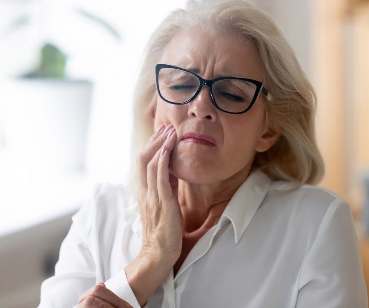 Woman with jaw pain