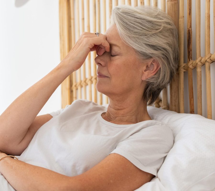 Woman bruxism-headache in bed image