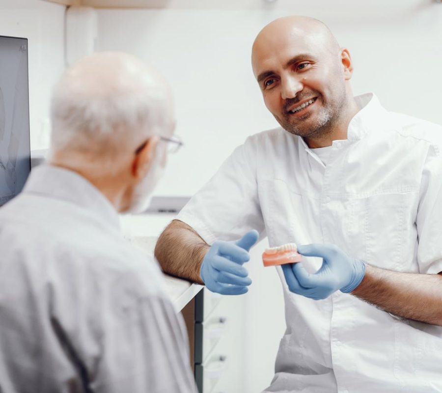 Dentist Talking To Patient