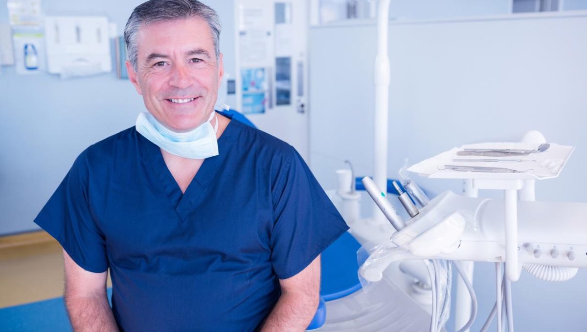 Dentist-Smiling-At-The-Dental-Clinic.jpg