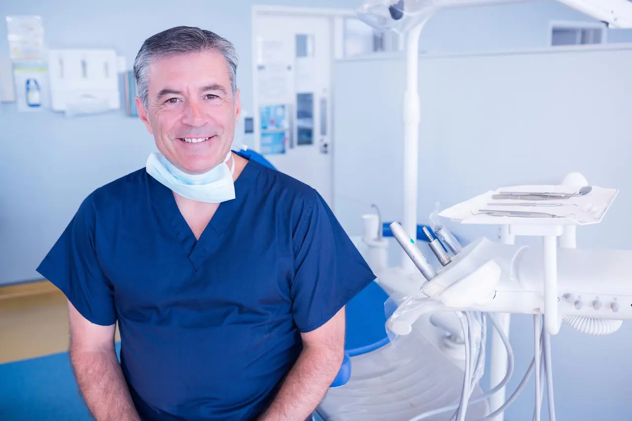 Dentist-Smiling-At-The-Dental-Clinic.jpg Dentist-Smiling-At-The-Dental-Clinic.jpg